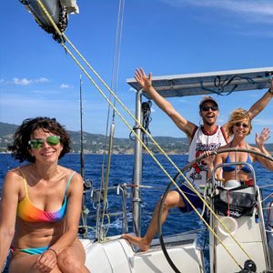 A group relaxing a private sailing experience